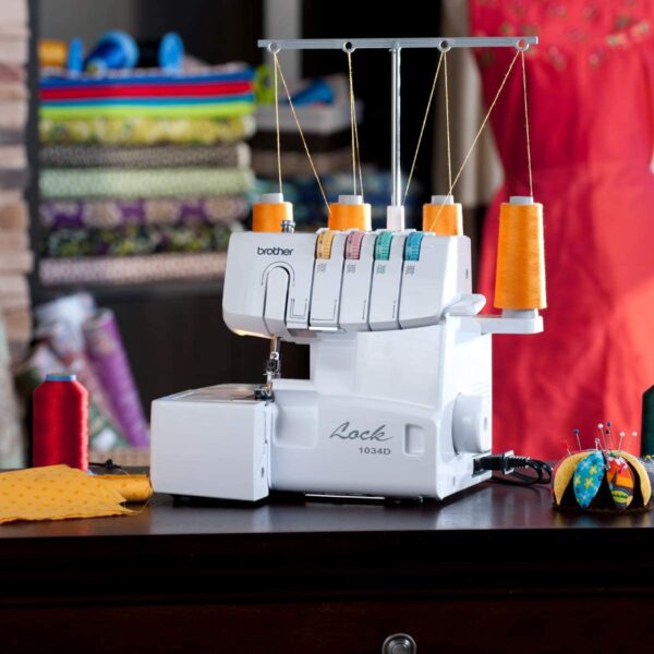 d0396b7553d6456bb73722a6a55d8878 1034D Serger, Heavy-Duty Metal Frame Overlock Machine, 1,300 Stitches Per Minute, Removeable Trim Trap, 3 Included Accessory Feet